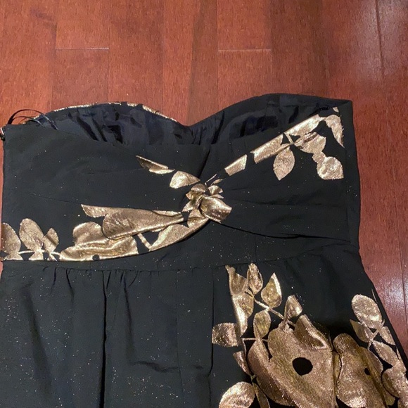 Black with gold strapless cocktail dress, gold shimmer through black under light - Picture 3 of 3